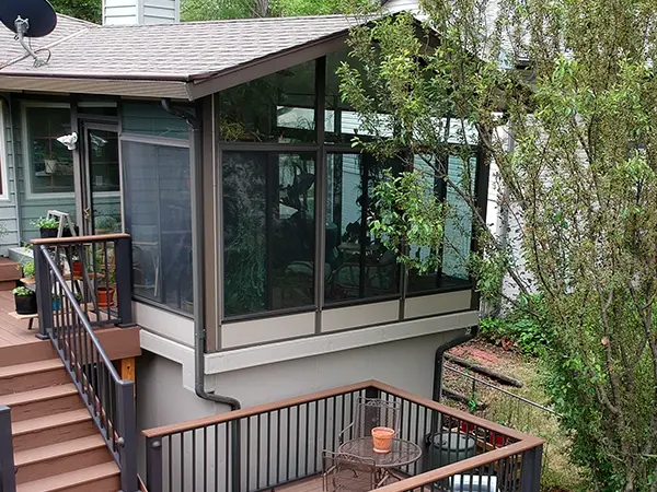 A screened-in porch and a wood deck