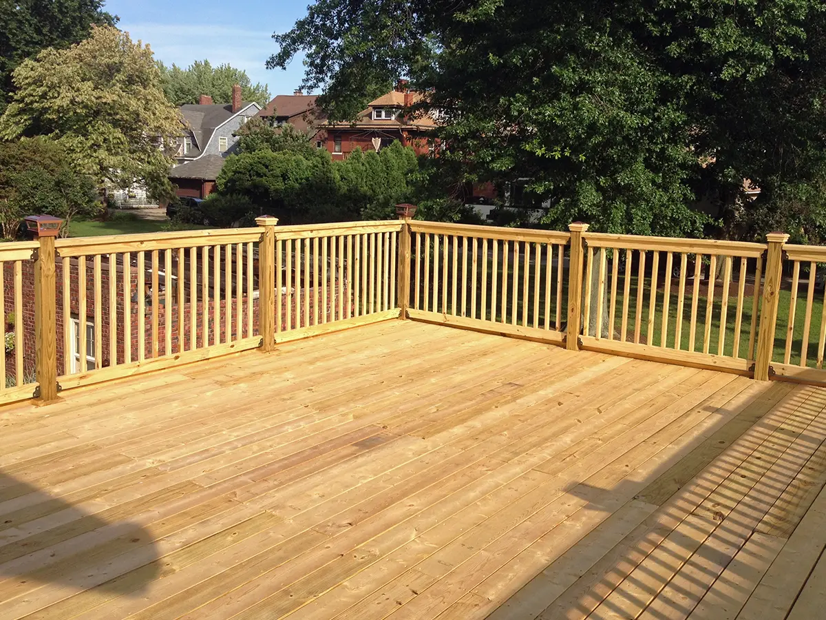A beautiful cedar deck with wood railings